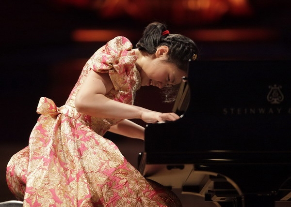 Girl Performing Piano at a Recital